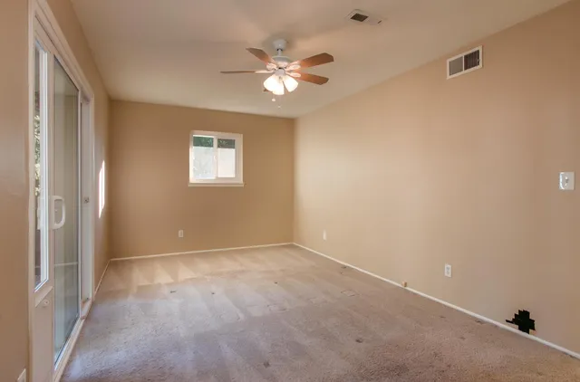 a view of an empty room with a window