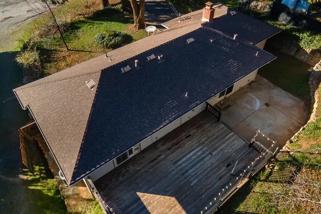 a view of a balcony with floor to ceiling windows with wooden floor