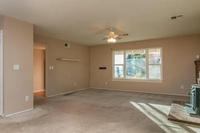 a view of livingroom with chandelier window