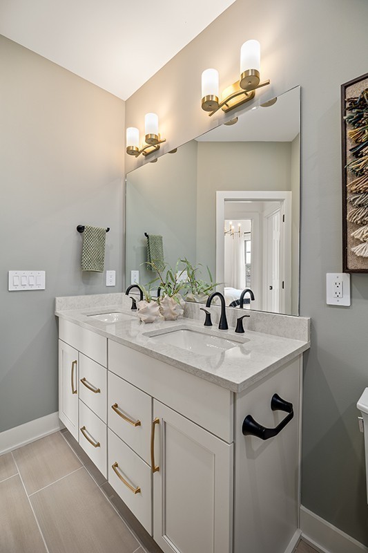 2615 Wilkinson Pike, Unit 1306 Murfreesboro, TN 37129 - Photo 22 of 45 a bathroom with a granite countertop sink a large mirror and a shower