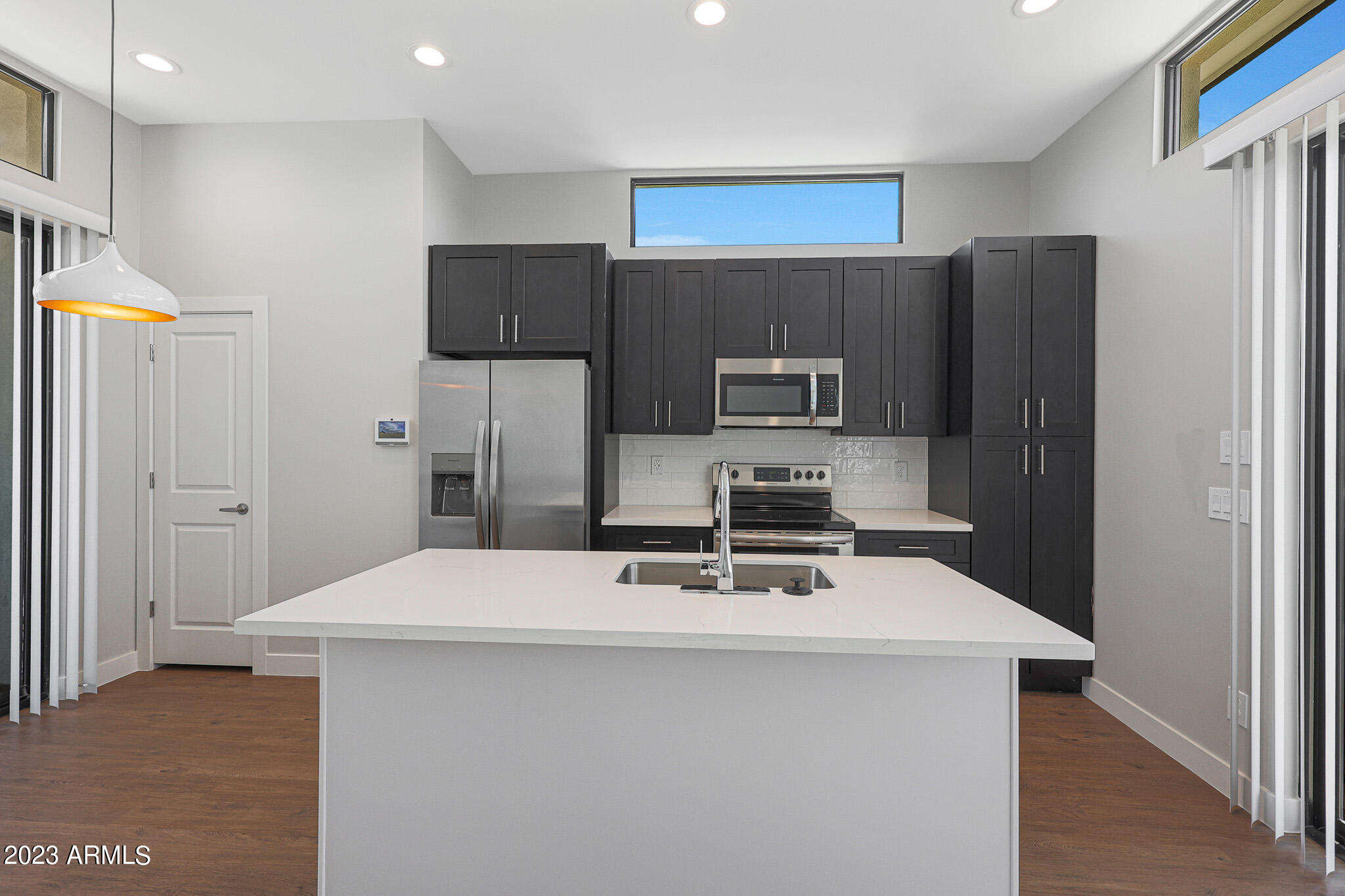 6060 East Baseline Road, Unit 151 Mesa, AZ 85206 - Photo 25 of 45 a kitchen with stainless steel appliances a refrigerator and a stove top oven
