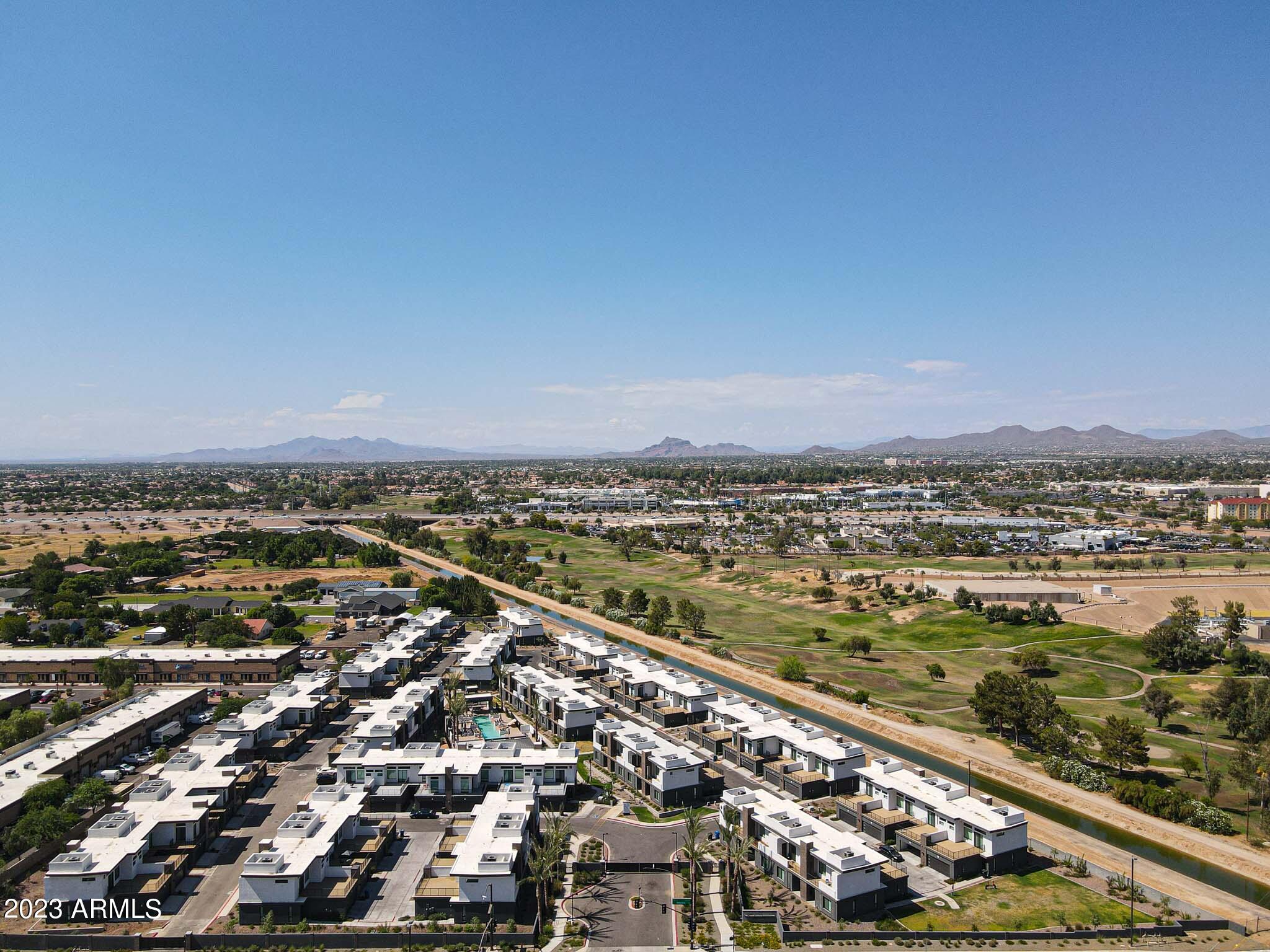 6060 East Baseline Road, Unit 151 Mesa, AZ 85206 - Photo 39 of 45 an aerial view of residential building and ocean view