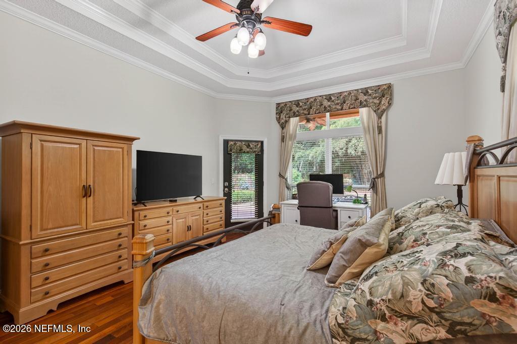 1483 Bridgette Way Fleming Island, FL 32003 - Photo 38 of 63 a bedroom with a bed and a flat screen tv