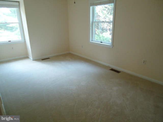 6838 Warfield Road Gaithersburg, MD 20882 - Photo 16 of 17 an empty room with a window