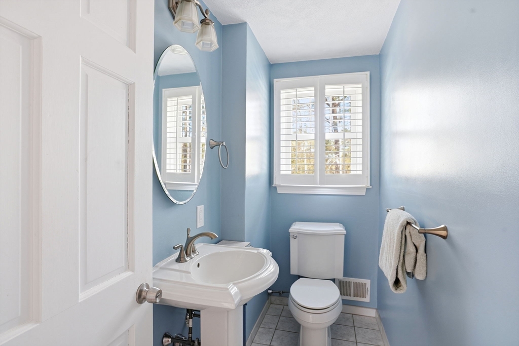 3 Fairway Drive Canton, MA 02021 - Photo 22 of 34 a bathroom with a toilet sink and mirror