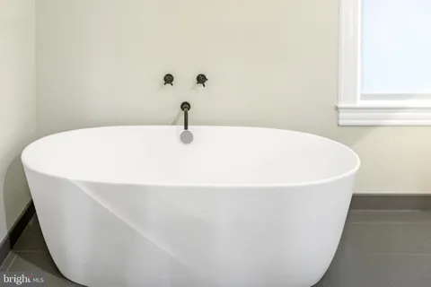 a white bath tub sitting in a bathroom