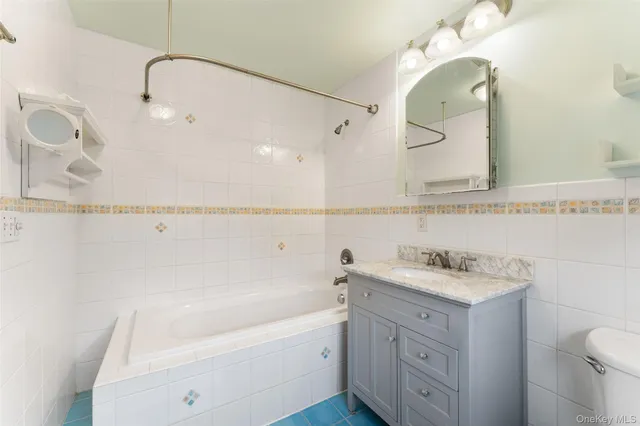 a bathroom with a sink a toilet and vanity