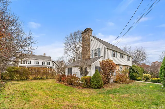 a view of a garden with large trees