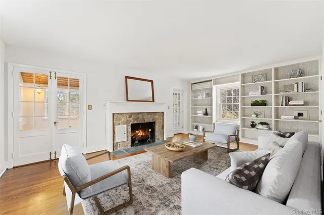 a living room with furniture and a fireplace