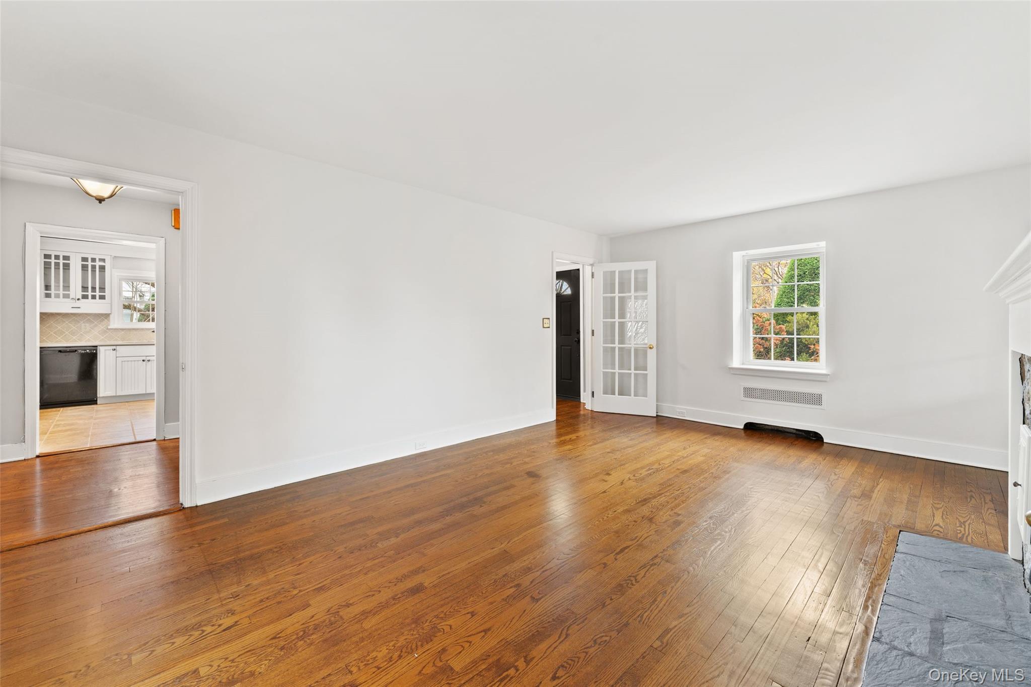 1 Winslow Circle Tuckahoe, NY 10707 - Photo 6 of 30 an empty room with wooden floor and windows