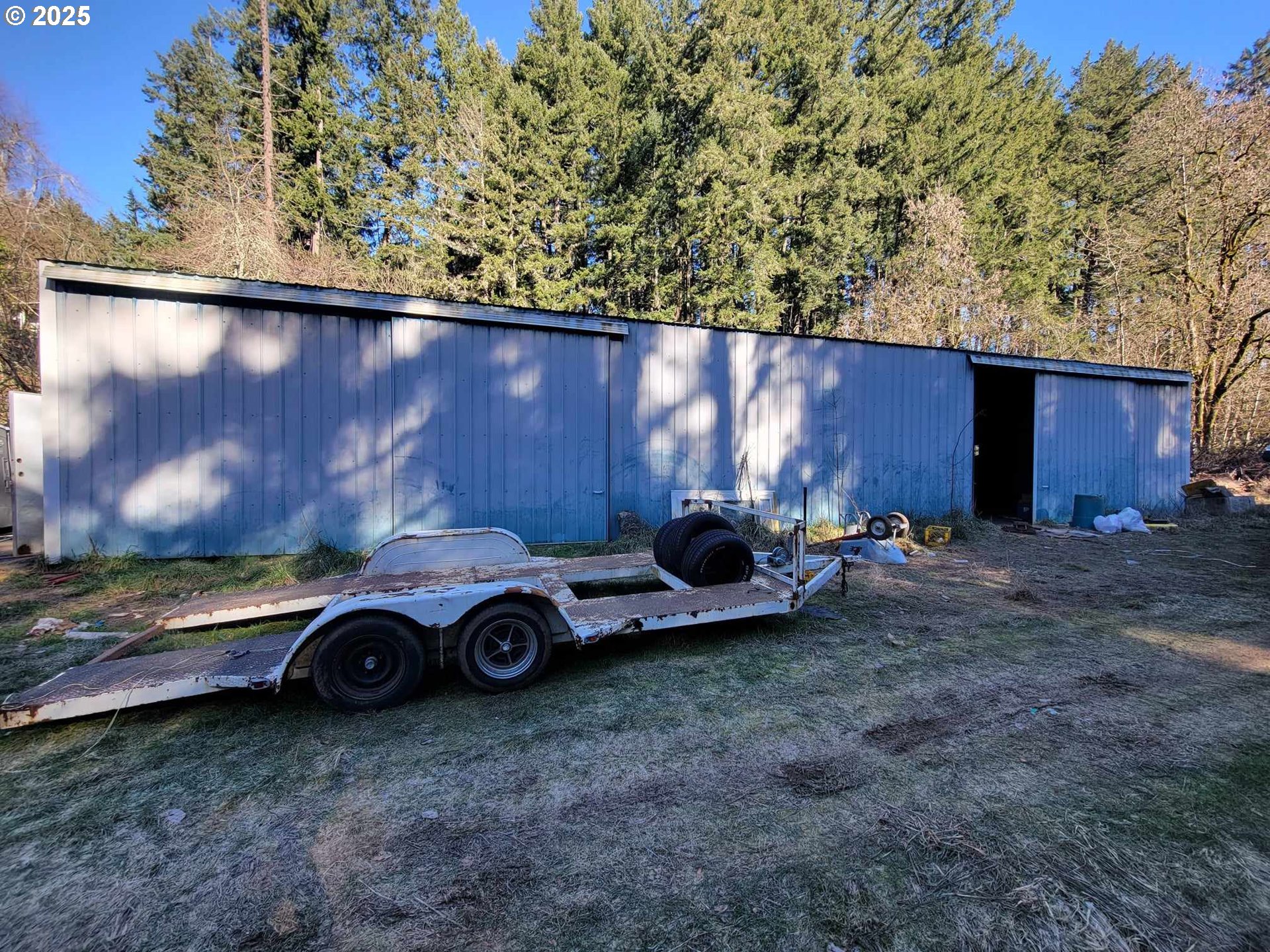 4295 Southwest Homesteader Road Wilsonville, OR 97070 - Photo 4 of 27 a car parked in a dirt field