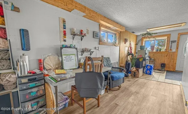 a living room with furniture a flat screen tv and a table