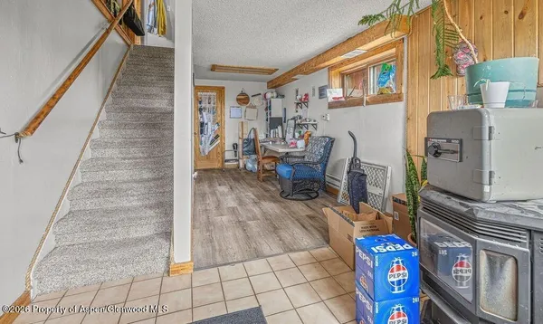 a balcony view with furniture and rug