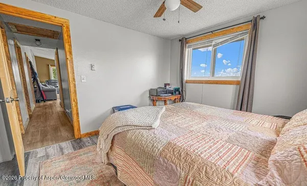 a bedroom with a bed and window