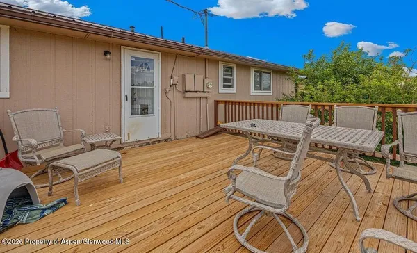 a view of balcony with wooden floor