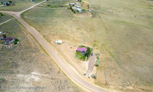 a view of a lake with a yard