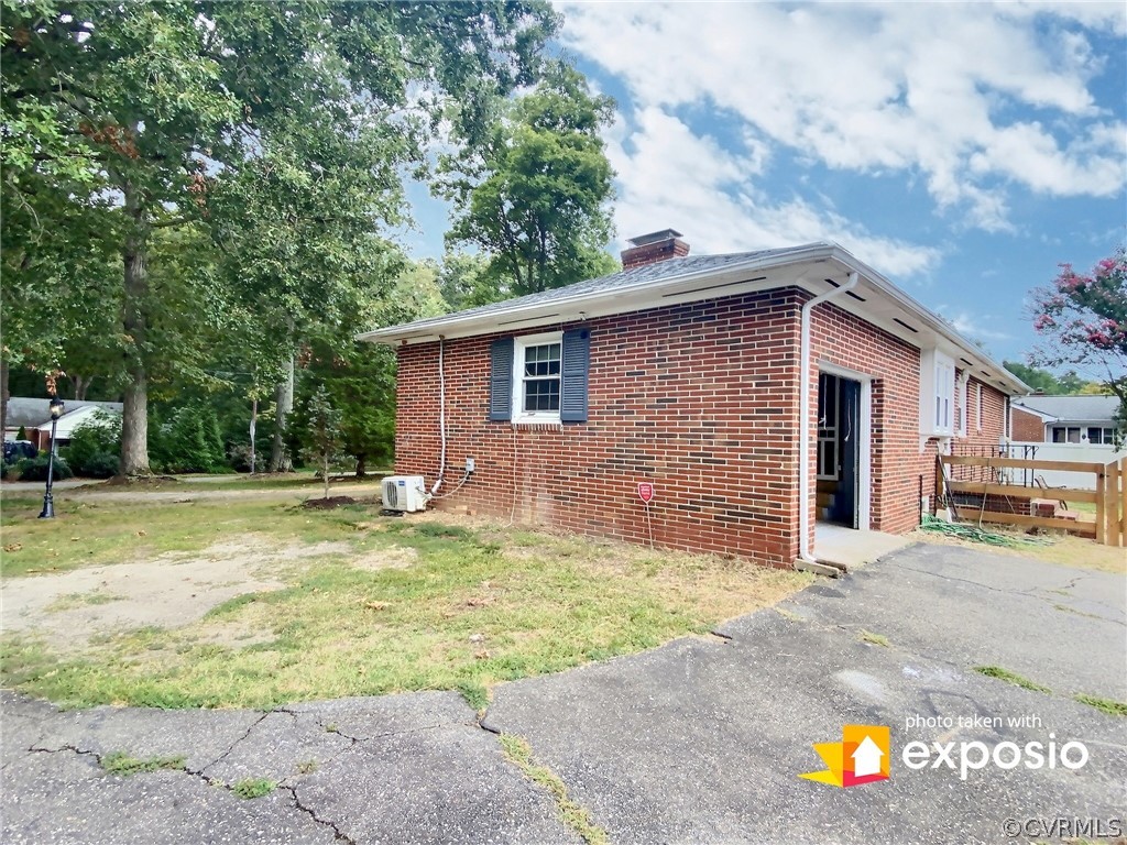 3625 Snyder Road Richmond, VA 23235 - Photo 6 of 27 The driveway side showing access to the garage, an