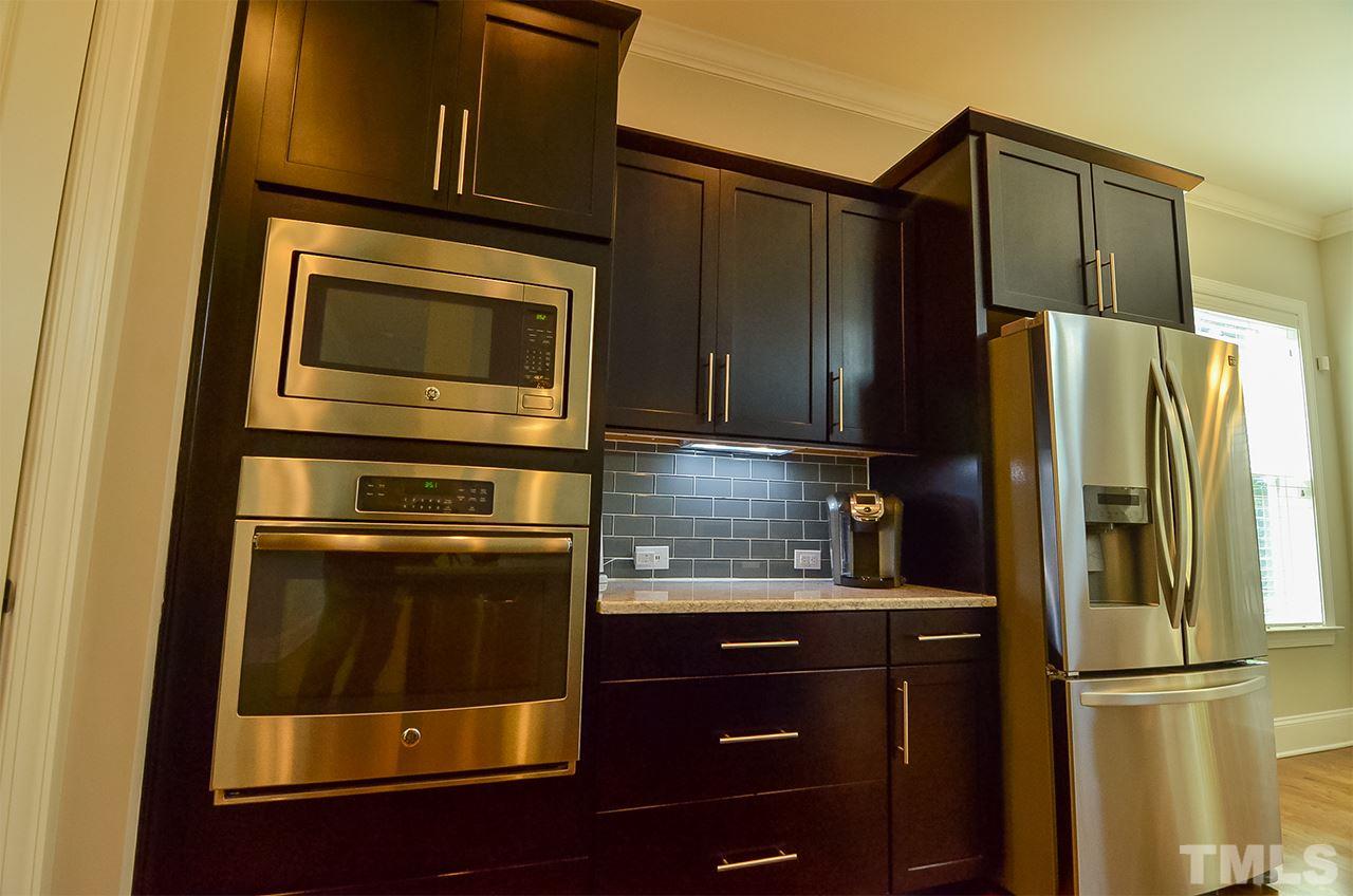 11824 Friendship Oak Trail Raleigh, NC 27613 - Photo 8 of 24 Wall mounted microwave and oven