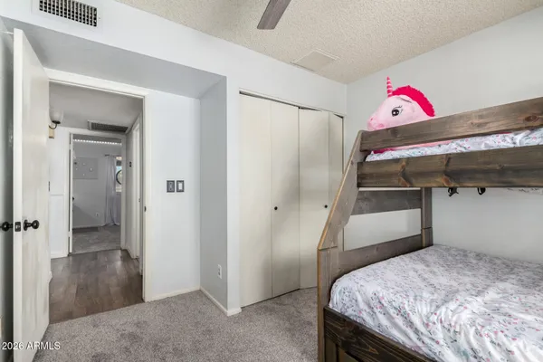 a bedroom with a bed and a walk in closet