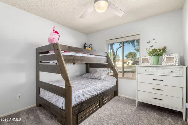 a bed room with a bed and a window