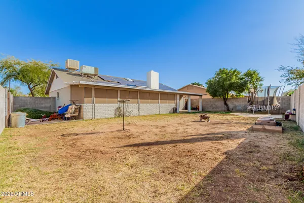 a house view with a backyard space