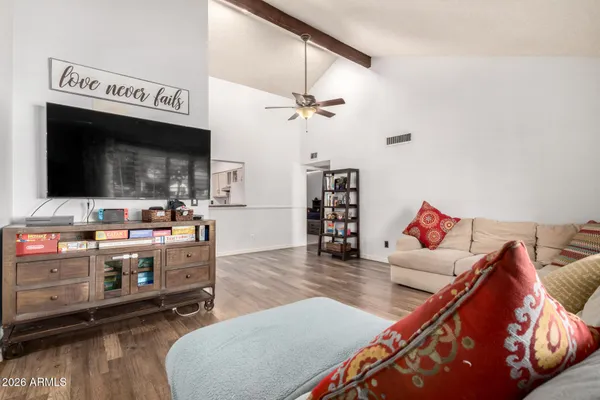 a living room with furniture and a flat screen tv