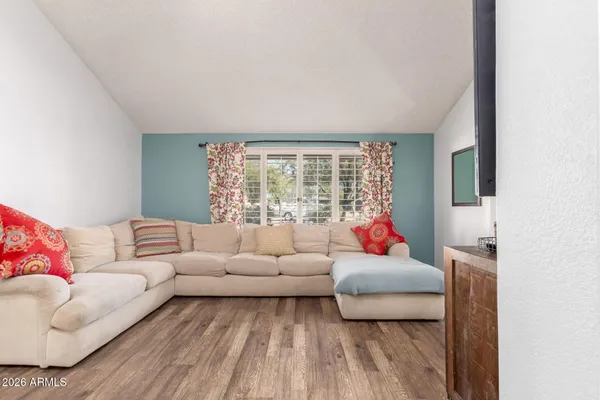 a living room with furniture and a large window