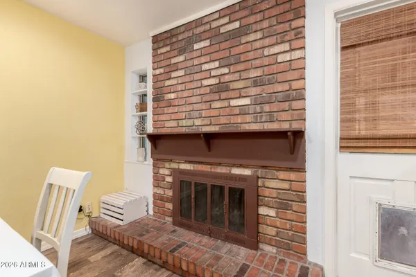 a view of fireplace and wooden floor