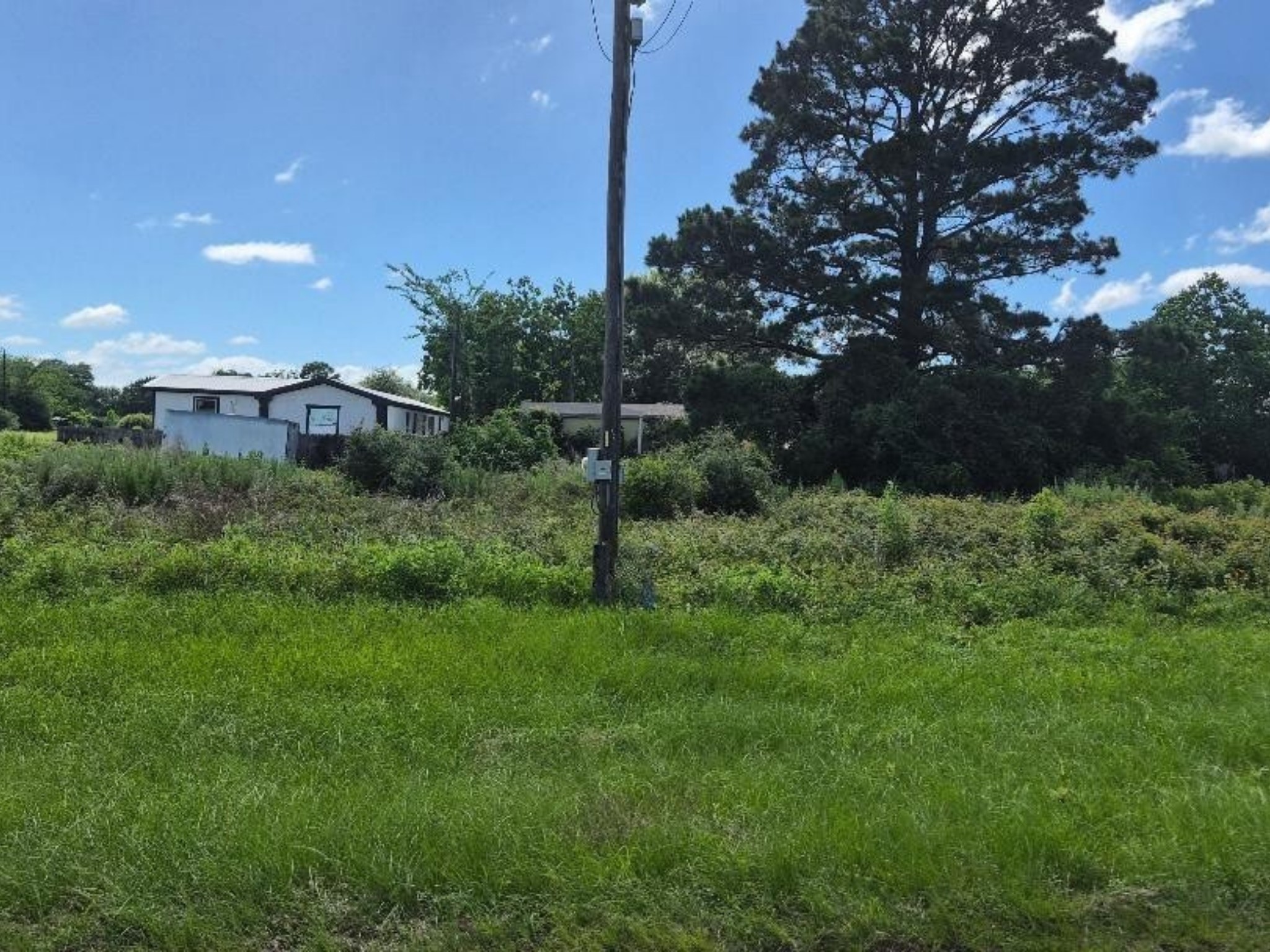 4 City Lots that face a spacious private ranch.