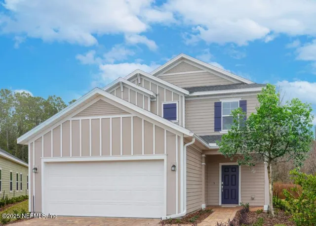 a house with a tree in front of it