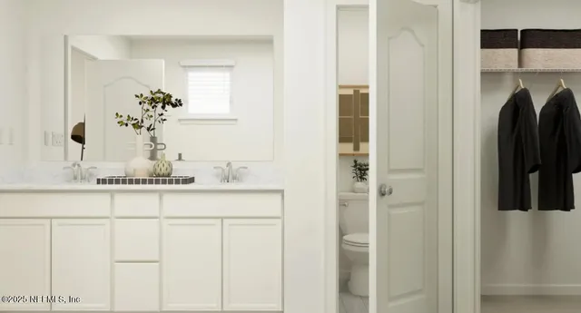 a view of a dining room with furniture and a potted plant