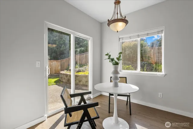 a dining room with furniture and a window
