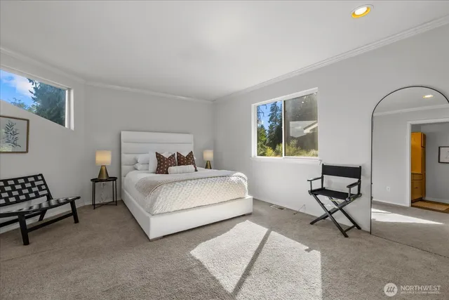 a bedroom with a bed and a couch