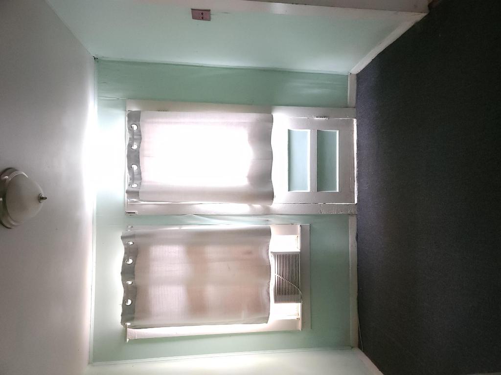 910 East 13th Street Austin, TX 78702 - Photo 15 of 16 a room that has a window in it