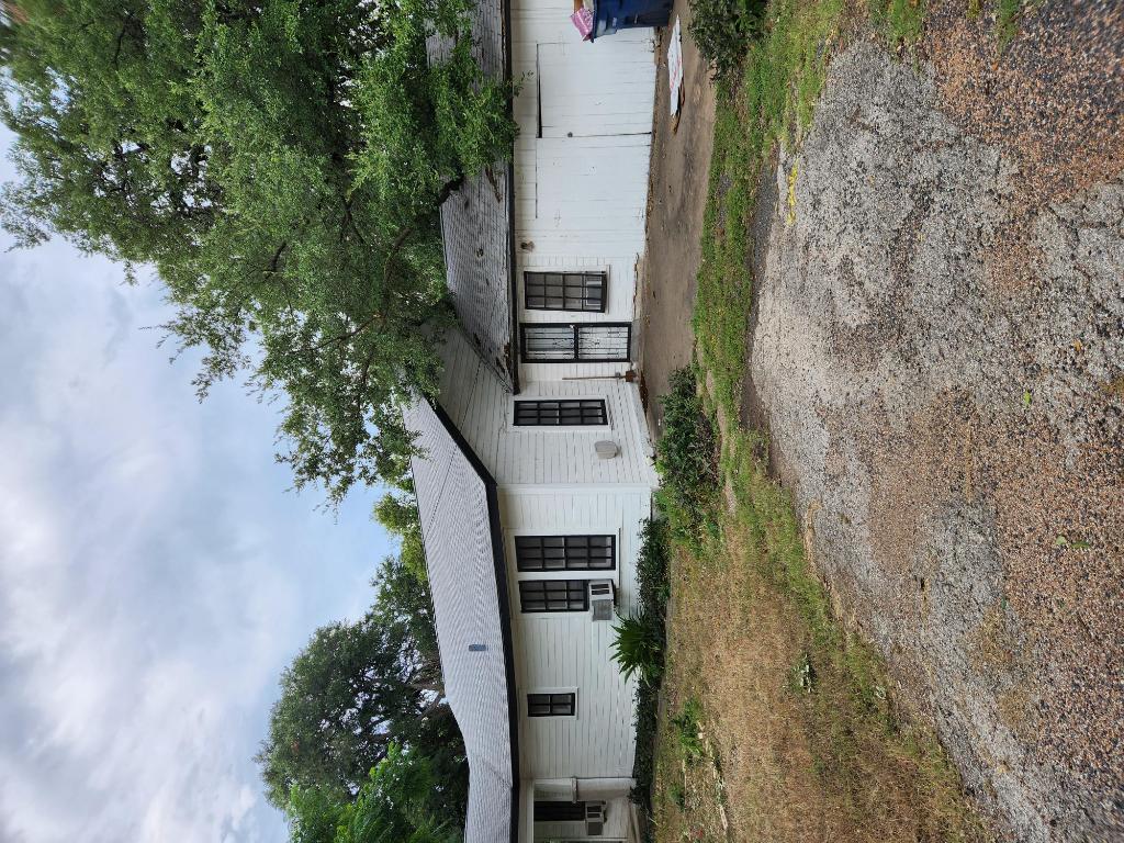 910 East 13th Street Austin, TX 78702 - Photo 3 of 16 a view of a house with a yard and a large tree