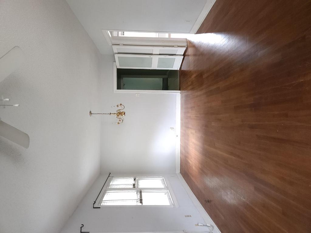 910 East 13th Street Austin, TX 78702 - Photo 5 of 16 an empty room with wooden floor and windows