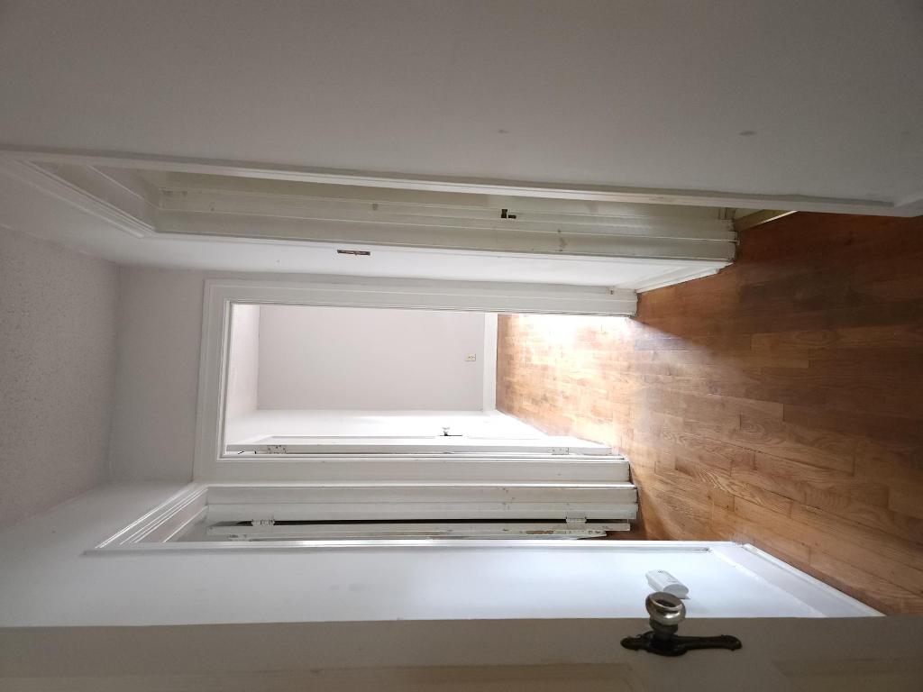 910 East 13th Street Austin, TX 78702 - Photo 8 of 16 a view of a hallway with wooden floor and a bathroom