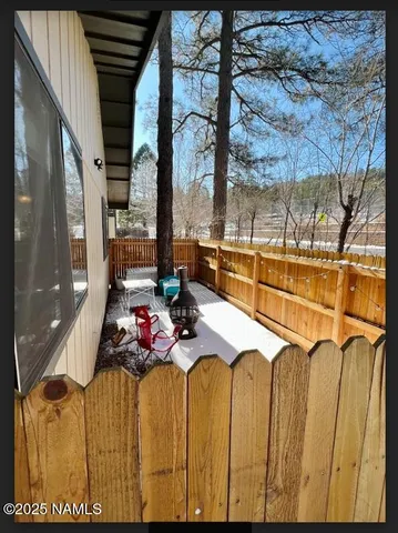a view of a balcony with furniture