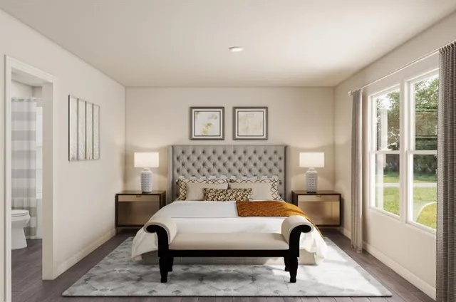 a bedroom with a bed and a window