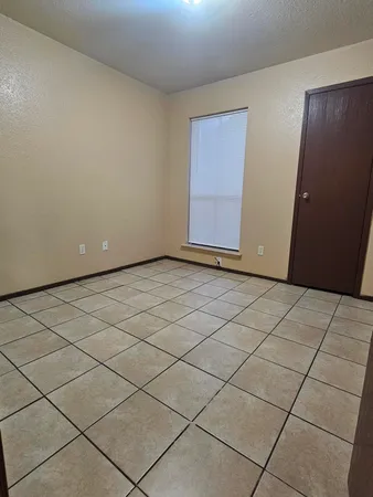 a view of a balcony with a floor to ceiling window
