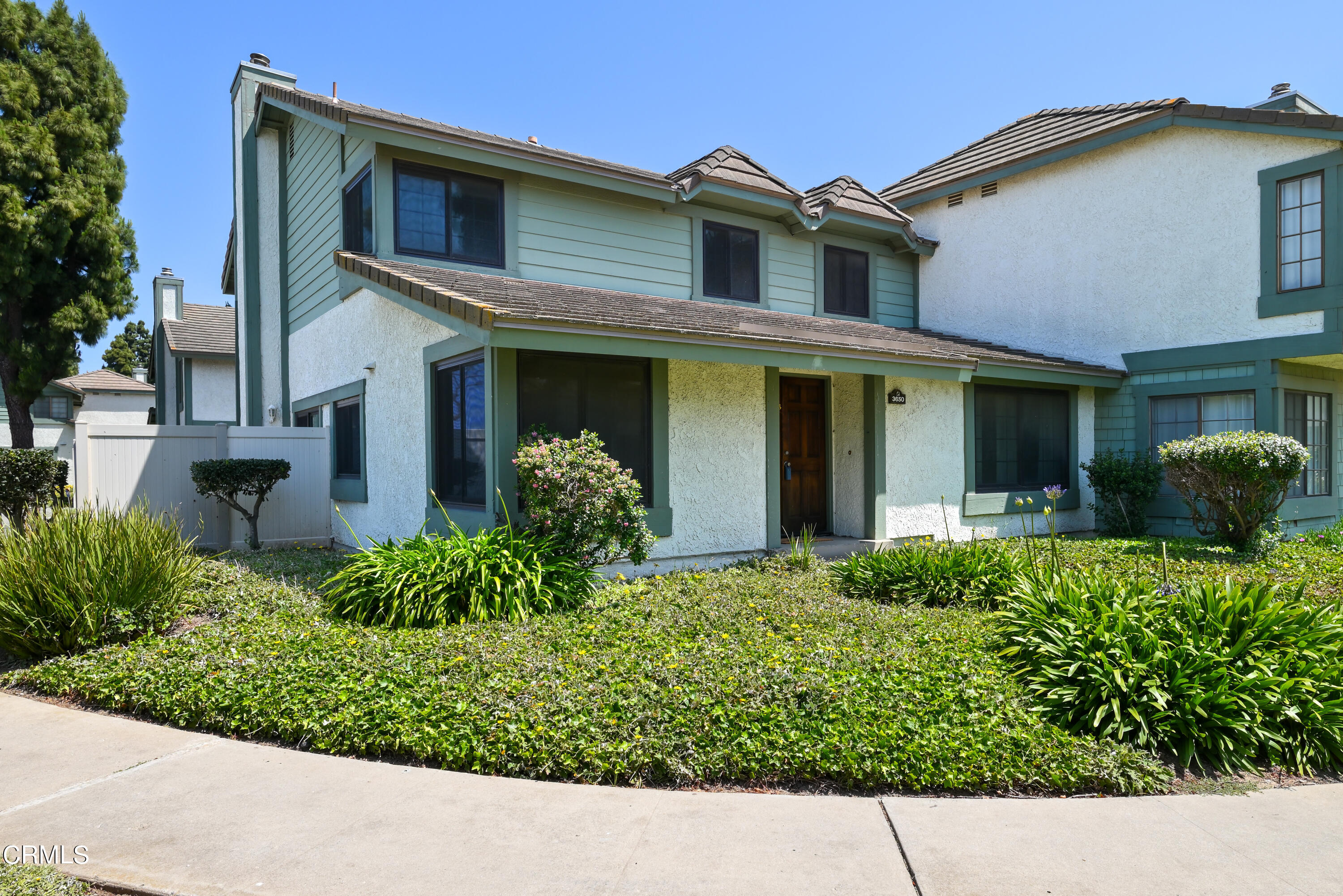 3650 Olds Road Oxnard, CA 93033 - Photo 1 of 27 a view of a house with a small yard plants and a large tree