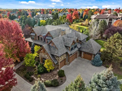 an aerial view of a house with a swimming pool