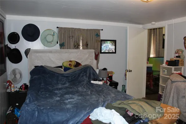 a bedroom with a bed and cabinets