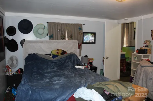 a bedroom with a bed and cabinets