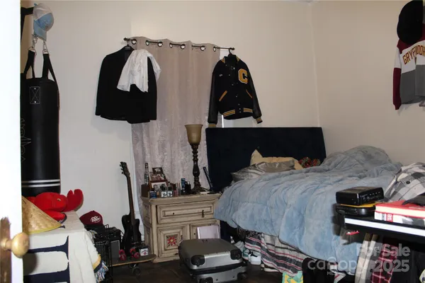 a bedroom with bed and a closet