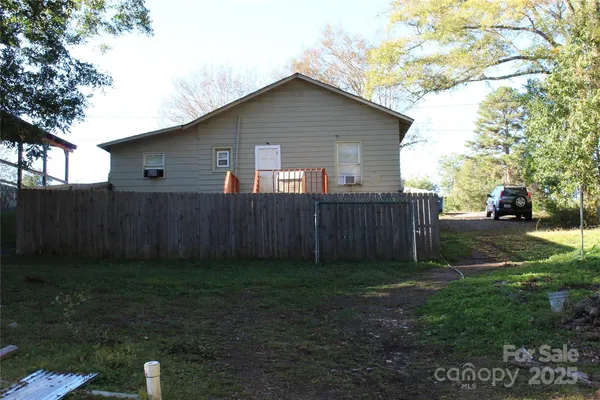 a front view of a house with yard and green space