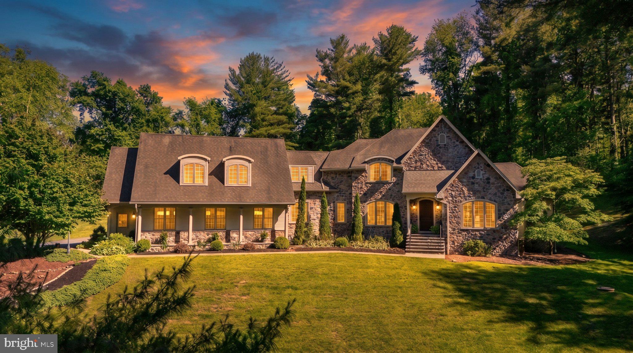 Charming stone home at sunset glow.