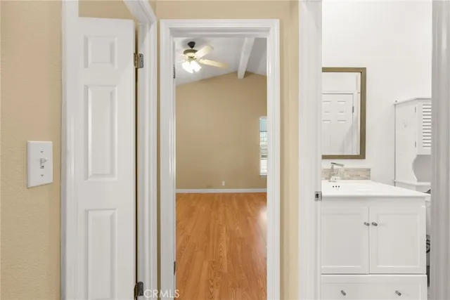 a bathroom with a sink a mirror and a shower