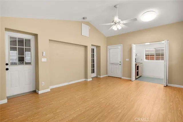 a outdoor space with patio the couches and pool table and chairs under an umbrella