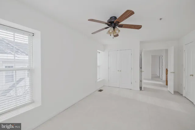 a view of an empty room and window